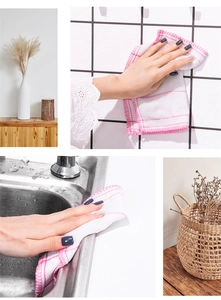 Absorbent white cleaning cloth with pink trim wiping tiles and a stainless steel sink