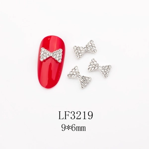 Détails des breloques nœud pour ongles avec strass et indication de taille 9x6mm