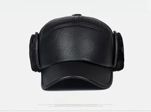 Close-up of black PU leather winter hat with thick faux fur ear flaps for senior men