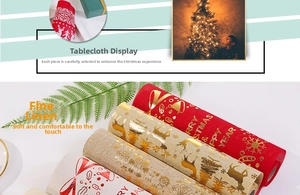Detail of linen Christmas table runners with gold foil reindeer and snowflake patterns