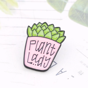 Macro detail of enamel succulent plant pin featuring hand-lettered Plant Lady text