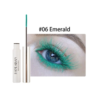 Emerald green mascara application on eyelashes and white tube with silver cap product view
