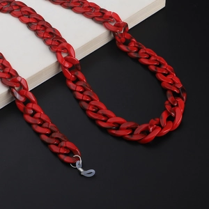 Close-up of red and black marble acrylic eyeglass chain with silicone loops
