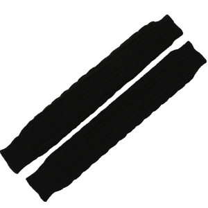 Detailed macro view of black cable knit pattern on warm winter fingerless sleeve covers