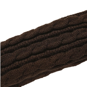 Macro shot of dark brown chunky cable knit texture on soft winter arm warmers