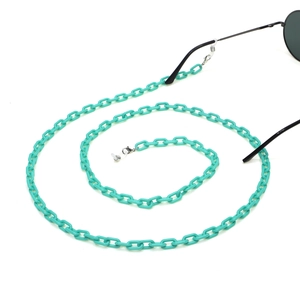Mint green acrylic eyeglass chain in a spiral layout on white background with sunglasses