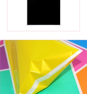 Detailed close-up showing the smooth texture and folded corner of a yellow pearlescent gift bag