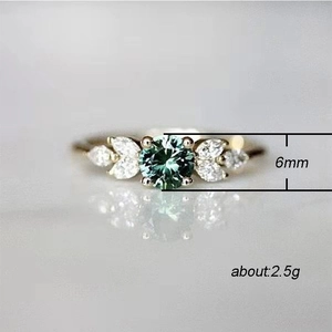 6mm round emerald ring with pear shaped side diamonds in golden band, weight 2.5g