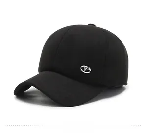 Close-up of side view of a black wool winter baseball cap with silver oval V metal logo