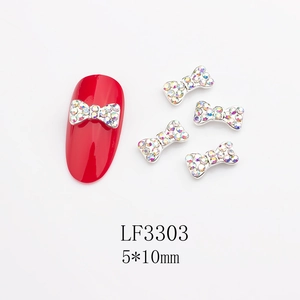Dettaglio decorazioni unghie a fiocco in metallo 5x10mm con strass e codice LF3303