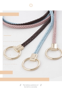 Close-up of woven knot belts with round gold alloy buckles in pink, blue, and brown