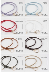 Detail view showing eight color options of woven waist belts with round gold alloy buckles