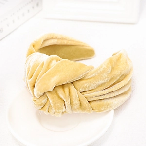 Elegant mustard yellow velvet knotted headband for women with a minimalist wide fabric design