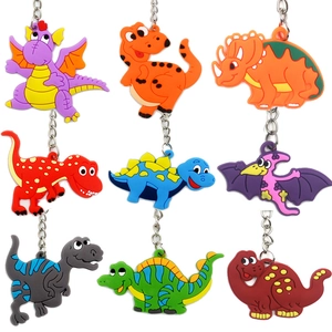 Set of 9 cute colorful PVC cartoon dinosaur keychains in various colors and shapes