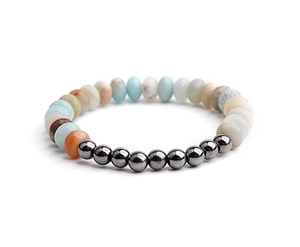 Detailed texture of natural stone beads and metallic hematite on a beaded bracelet