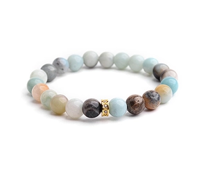 Close-up of multicolor natural stone beads bracelet with gold zircon paved spacer charm
