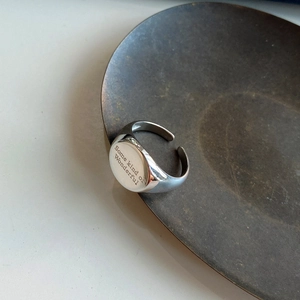 Macro shot of 925 sterling silver ring with Some kind of Wonderful engraving