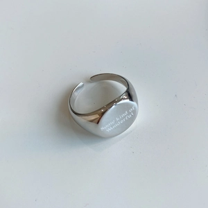 Macro shot of 925 sterling silver signet ring with Some kind of Wonderful engraving