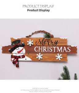 Close-up of wooden Merry Christmas wall hanging with a 3D snowman and snowflakes