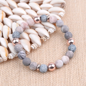 Yoga lava stone beaded bracelet with pink marble gems and rose gold accents on seashell