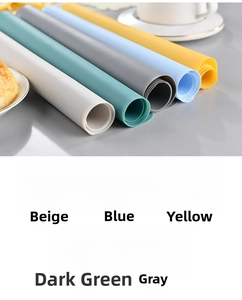 Roll of five-color silicone placemats showing beige, blue, yellow, green and grey options