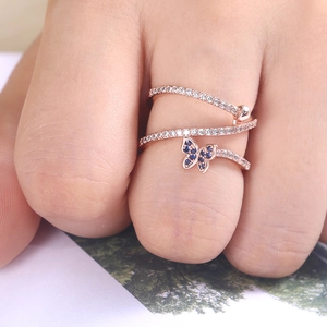 Elegant rose gold triple-layer ring with blue butterfly and pave-set zircons