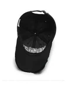 Detail view of the washed cotton baseball cap inner lining and metallic adjustment buckle