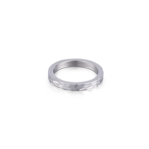 Minimalist silver titanium steel ring with hand-hammered texture on white background