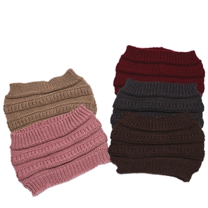 Detail of five colored knit headbands showing soft textured wool fabric and stitching