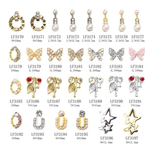 Macro display of golden reindeer nail charms with inlaid rhinestones and pearls for DIY