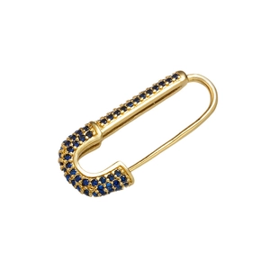 Detailed close-up of a gold safety pin earring with micro-pave blue zircon accents