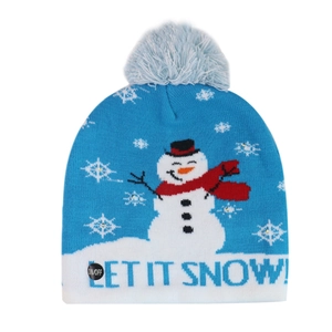 Detail of blue knitted Christmas hat showing the power button and Let It Snow text