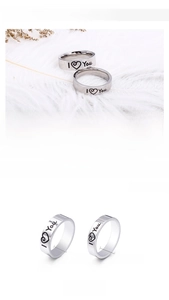 Detail showing 5mm and 6mm wide stainless steel rings with I Love You engraving