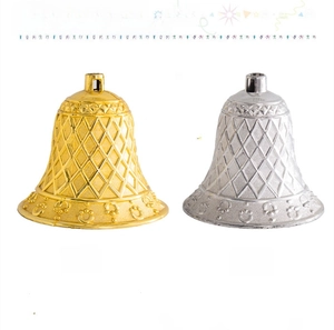 Detail of gold and silver Christmas grid bells with embossed patterns and top hanging loops