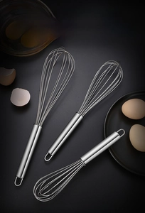 Three-piece 304 stainless steel egg beater set with ergonomic hooks on black texture