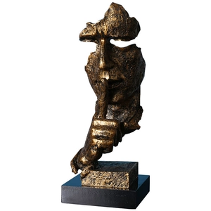 Silence Is Gold bronze sculpture of a face with shushing gesture on black base