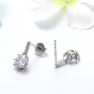 Macro shot showing S925 hallmark on silver earrings with cubic zirconia stones