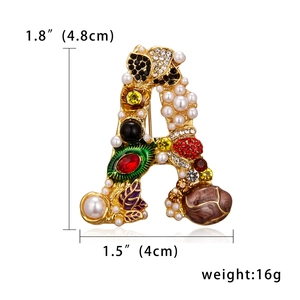 Detailed size view of a vintage gold Letter A brooch with colorful gems and pearls