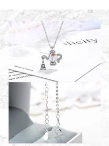 Detailed view of S925 sterling silver teapot necklace with crystal and hallmark