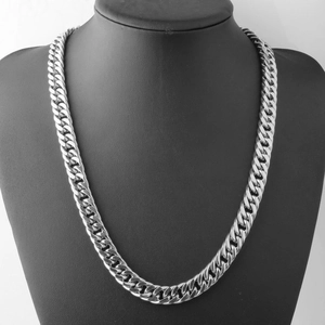 Close-up of thick silver Cuban link chain necklace displayed on a black male mannequin