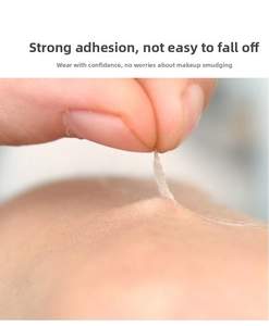 Macro shot showing the strong adhesion of invisible lace eyelid tape on skin surface