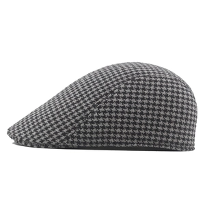 Classic houndstooth flat cap for winter featuring padded warm fabric and side profile view