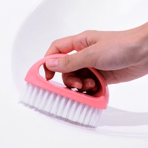 Pink egg-shaped laundry brush with ergonomic handle for efficient clothes and shoes cleaning