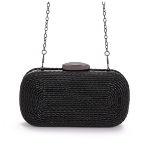 Detailed close-up of black woven texture and dark grey metal chain on evening clutch bag