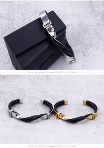 Dettaglio di bracciali in pelle intrecciata con metallo ritorto e strass neri