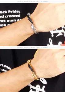 Dettaglio di un bracciale a cavo in acciaio ritorto con pelle intrecciata nera da uomo