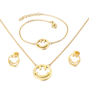 Golden titanium steel jewelry set with hollow smiley face necklace bracelet and earrings