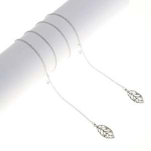 Detail of silver leaf pendant eyewear chain with non-slip silicone loop on white display