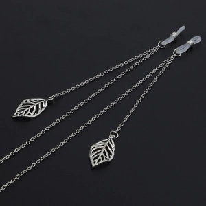 Silver metal eyewear chain with hollow leaf charms and non-slip silicone loops