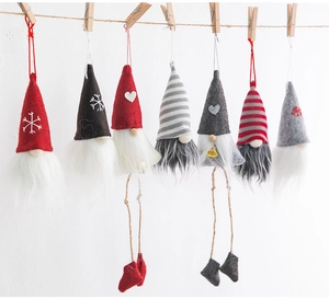 Detailed view of handmade wool felt Christmas gnomes set for festive tree decoration